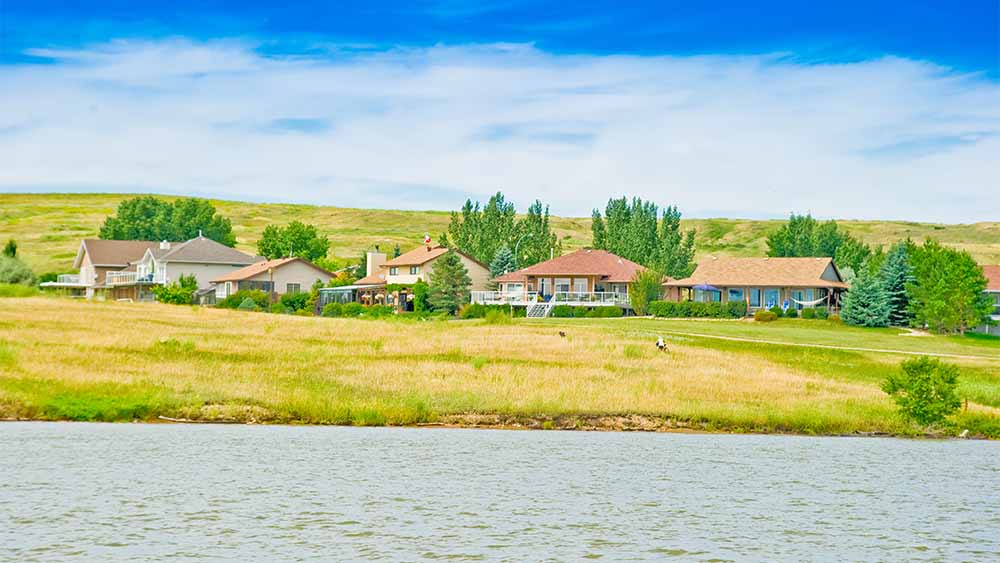 View of a group of cabins taken from a boat on the lake